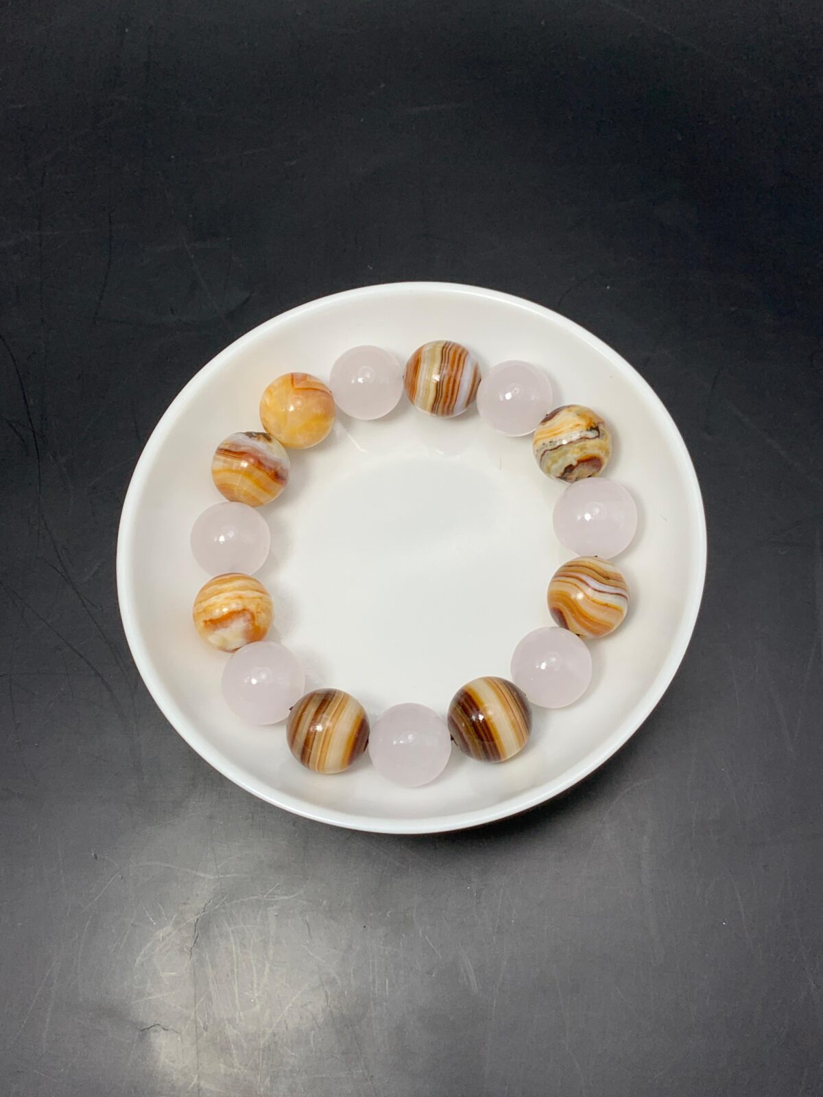 Pink calcite with brown aragonite bracelet